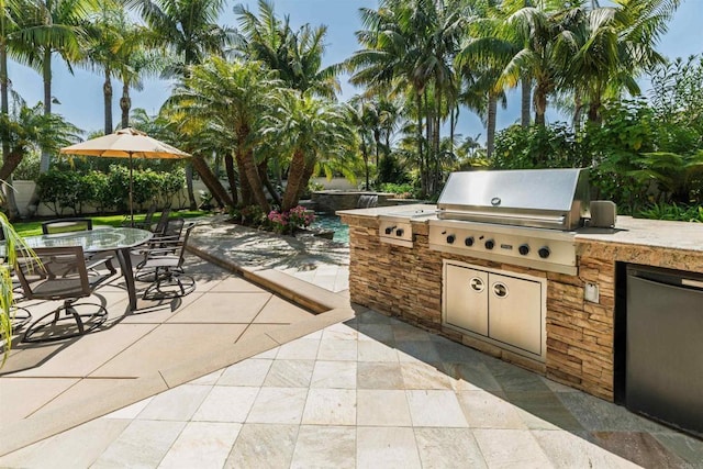 view of patio / terrace with outdoor dining space, grilling area, and area for grilling