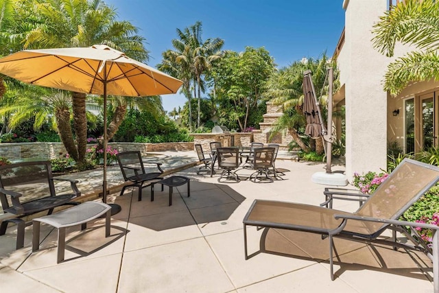 view of patio with outdoor dining area