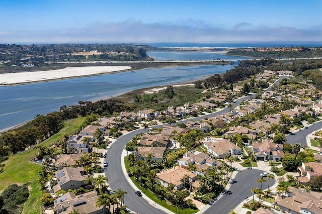drone / aerial view featuring a water view and a residential view