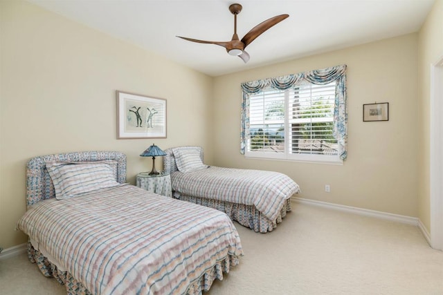 bedroom with baseboards, a ceiling fan, and carpet floors