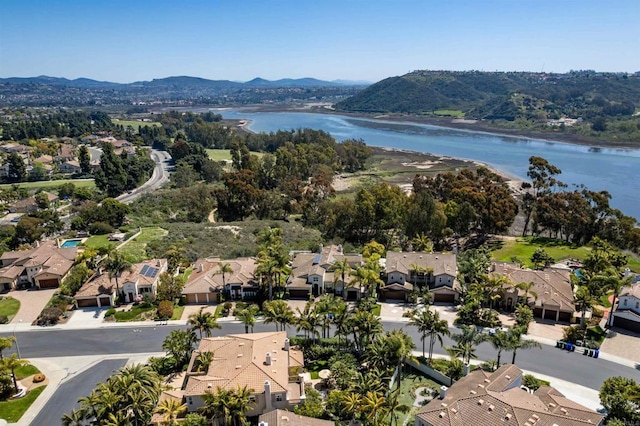 bird's eye view featuring a water and mountain view and a residential view