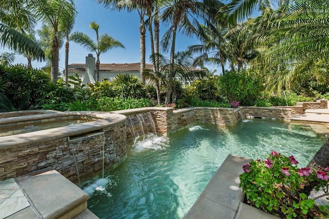 outdoor pool with an in ground hot tub