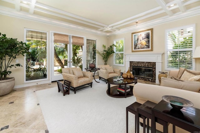 living room with a healthy amount of sunlight, crown molding, and coffered ceiling