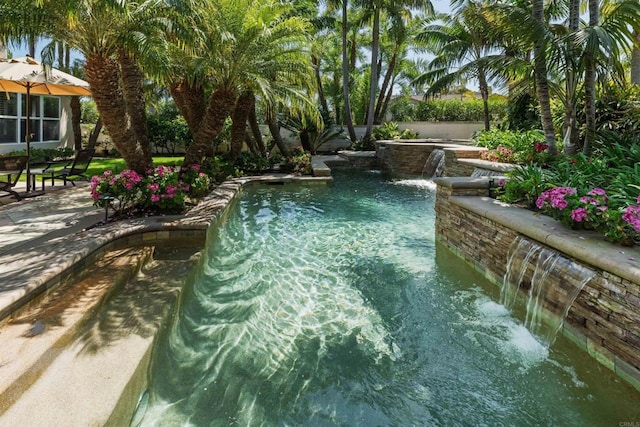 view of swimming pool featuring a fenced in pool and a patio
