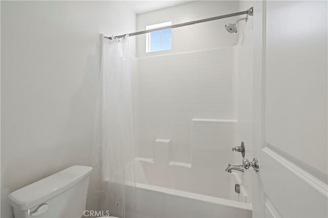 bathroom with toilet and shower / bath combination with curtain