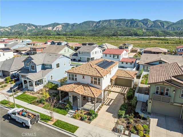 aerial view featuring a mountain view and a residential view