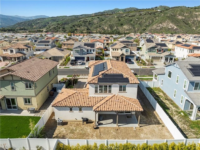 birds eye view of property featuring a mountain view and a residential view
