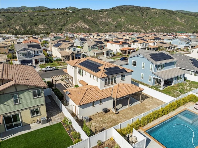 drone / aerial view with a mountain view and a residential view