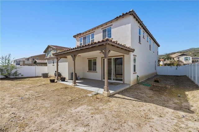back of property featuring a patio area, central air condition unit, a fenced backyard, and stucco siding