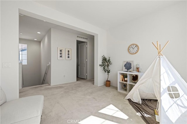 recreation room featuring visible vents, recessed lighting, and carpet floors