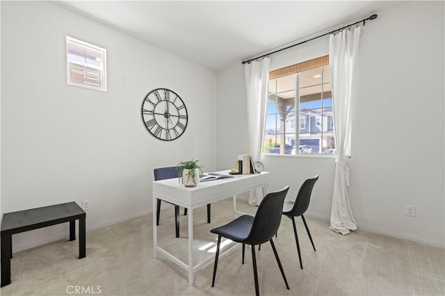 office space with baseboards and carpet