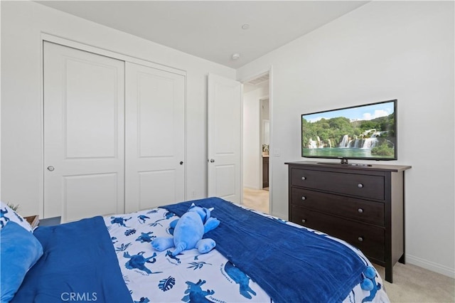 bedroom with light carpet, a closet, baseboards, and visible vents