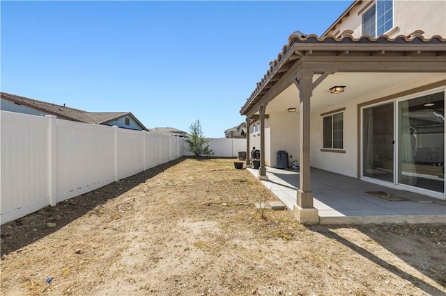 view of yard with a patio and a fenced backyard