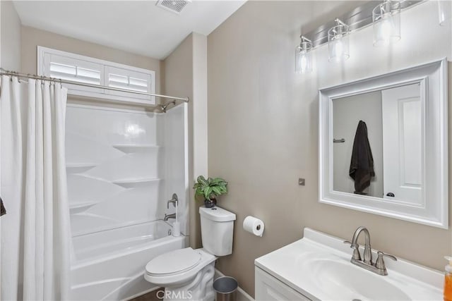 bathroom featuring vanity, shower / bath combo with shower curtain, visible vents, and toilet