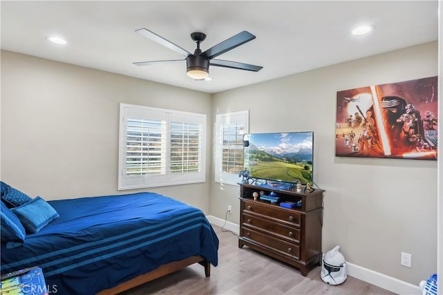 bedroom featuring baseboards, recessed lighting, ceiling fan, and wood finished floors