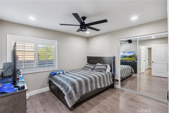 bedroom with baseboards, recessed lighting, ceiling fan, and wood finished floors