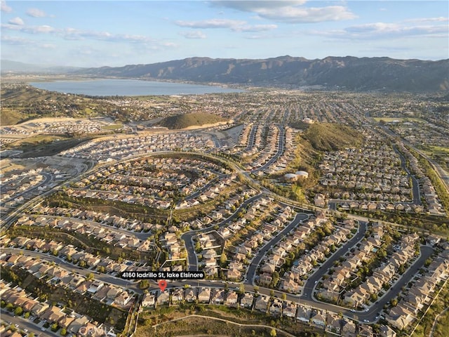 aerial view featuring a water and mountain view