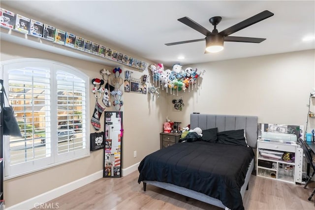 bedroom with wood finished floors, ceiling fan, baseboards, and recessed lighting
