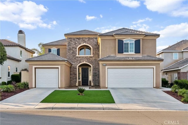 view of front of house with driveway, stucco siding, stone siding, and a tile roof