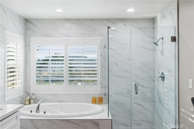 full bath with a garden tub, a marble finish shower, vanity, and recessed lighting