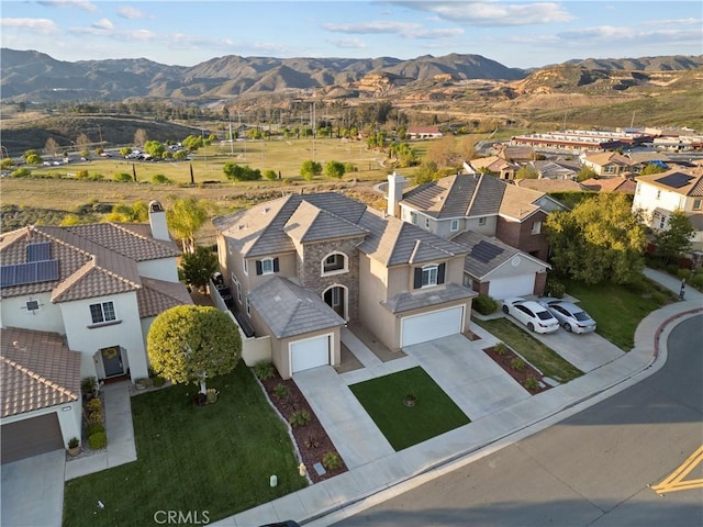 aerial view with a mountain view and a residential view