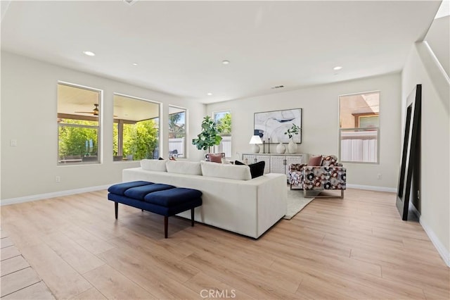 11102 Duran, Jurupa Valley, CA 91752 - living room featuring baseboards, light wood-type flooring, and recessed lighting