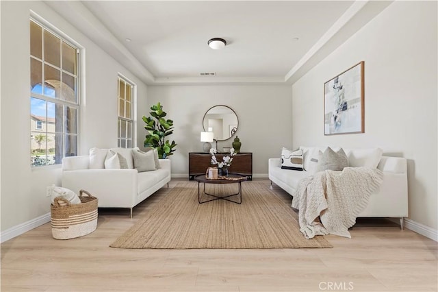 11102 Duran, Jurupa Valley, CA 91752 - living room featuring light wood-type flooring, baseboards, and visible vents