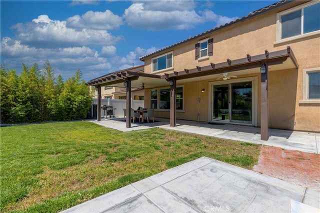 11102 Duran, Jurupa Valley, CA 91752 - back of house featuring a ceiling fan, a patio, a lawn, and stucco siding