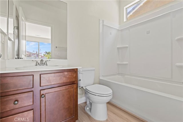 11102 Duran, Jurupa Valley, CA 91752 - bathroom featuring toilet, a healthy amount of sunlight, vanity, and wood finished floors