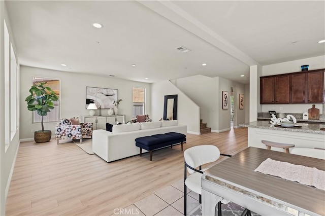 11102 Duran, Jurupa Valley, CA 91752 - dining area featuring visible vents, a wealth of natural light, light wood-style floors, recessed lighting, and stairway