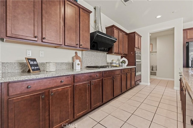 11102 Duran, Jurupa Valley, CA 91752 - kitchen with baseboards, light tile patterned floors, backsplash, wall chimney exhaust hood, and stainless steel appliances