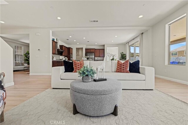 11102 Duran, Jurupa Valley, CA 91752 - living area with recessed lighting, plenty of natural light, and light wood finished floors