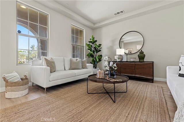11102 Duran, Jurupa Valley, CA 91752 - living area with visible vents, baseboards, and wood finished floors