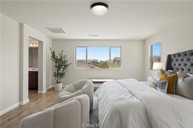 11102 Duran, Jurupa Valley, CA 91752 - bedroom featuring light wood-style floors, visible vents, baseboards, and connected bathroom