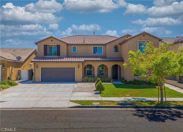 11102 Duran, Jurupa Valley, CA 91752 - mediterranean / spanish-style home with an attached garage, stucco siding, a front lawn, and a tile roof