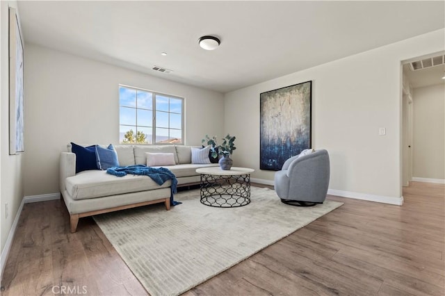11102 Duran, Jurupa Valley, CA 91752 - living area featuring visible vents, baseboards, and wood finished floors