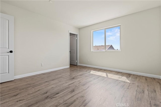 11102 Duran, Jurupa Valley, CA 91752 - unfurnished bedroom with baseboards and wood finished floors