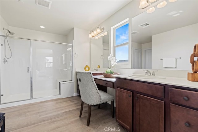 11102 Duran, Jurupa Valley, CA 91752 - bathroom featuring visible vents, a shower stall, vanity, and wood finished floors