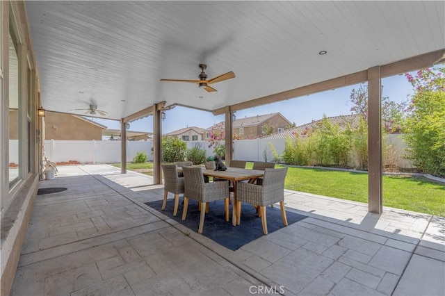 11102 Duran, Jurupa Valley, CA 91752 - view of patio with outdoor dining area, a fenced backyard, and a ceiling fan
