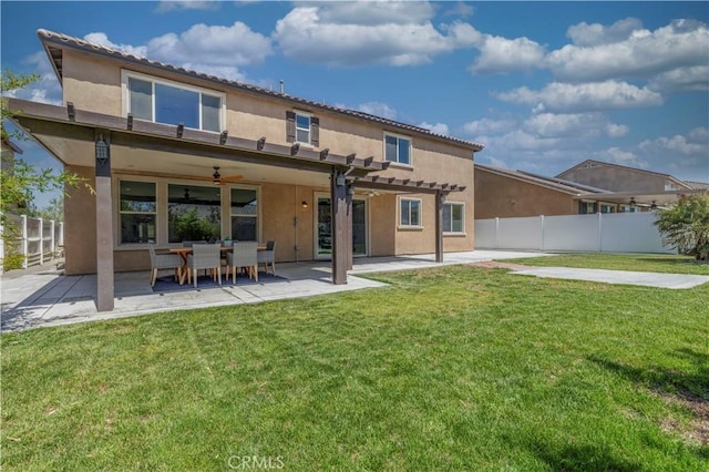 11102 Duran, Jurupa Valley, CA 91752 - rear view of property featuring a pergola, a ceiling fan, a lawn, fence, and stucco siding