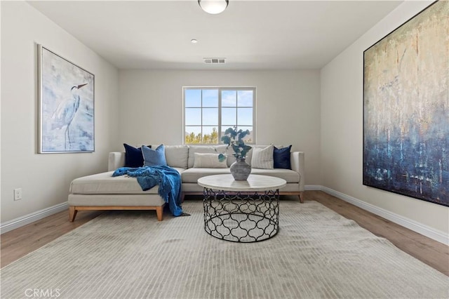 11102 Duran, Jurupa Valley, CA 91752 - living area with visible vents, baseboards, and wood finished floors
