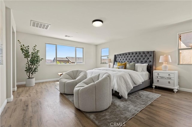 11102 Duran, Jurupa Valley, CA 91752 - bedroom with wood finished floors, baseboards, and visible vents