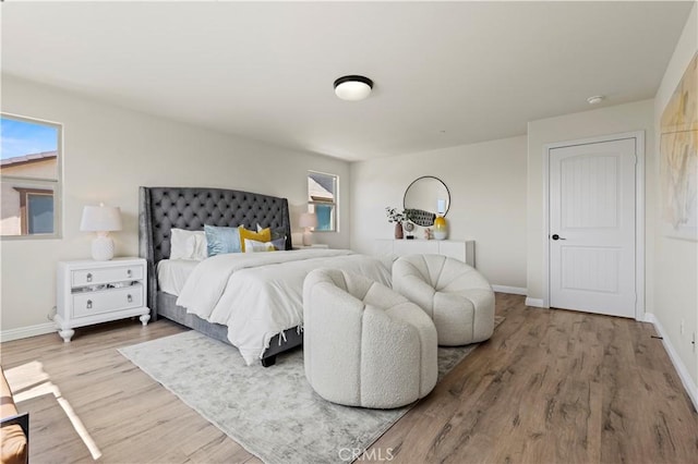 11102 Duran, Jurupa Valley, CA 91752 - bedroom featuring baseboards and wood finished floors