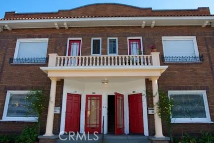 324 W 9th St, Long Beach, CA 90813 - view of front of house featuring a balcony and a porch