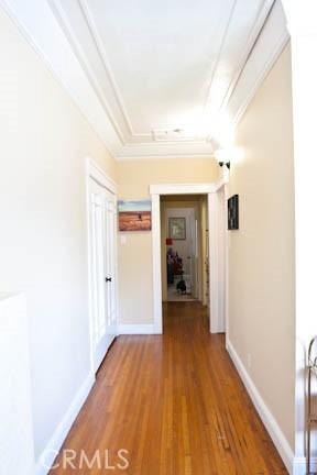 324 W 9th St, Long Beach, CA 90813 - corridor with wood finished floors, crown molding, and baseboards
