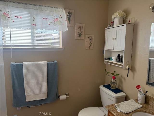 half bath with toilet and vanity