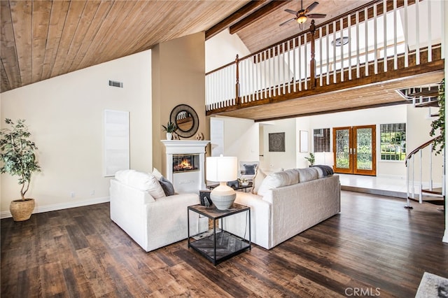 22316 Bear Creek Dr S, Murrieta, CA 92562 - living area featuring french doors, visible vents, a glass covered fireplace, wood finished floors, and high vaulted ceiling