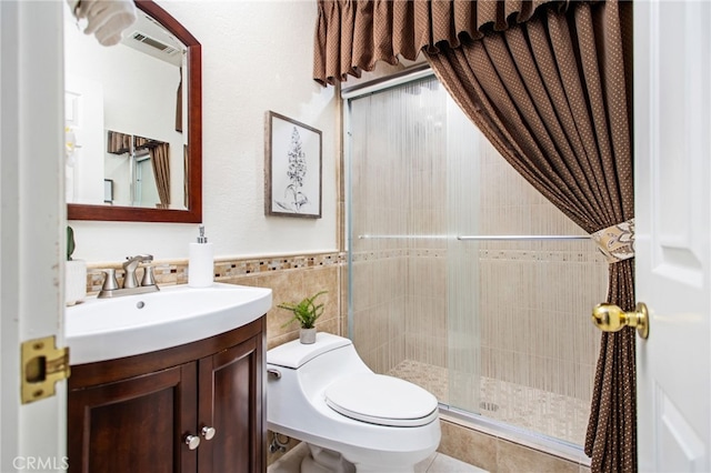 22316 Bear Creek Dr S, Murrieta, CA 92562 - bathroom with a stall shower, vanity, tile walls, toilet, and visible vents