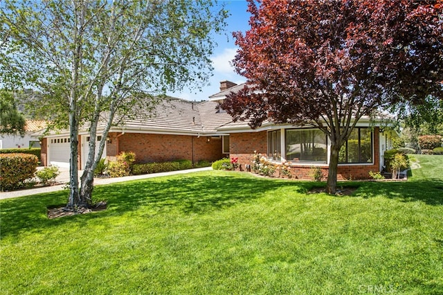 22316 Bear Creek Dr S, Murrieta, CA 92562 - view of front of property featuring a chimney, a front lawn, driveway, brick siding, and a garage