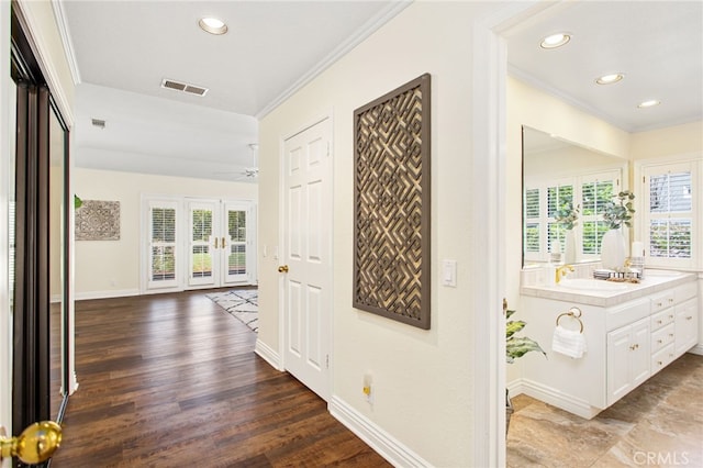 22316 Bear Creek Dr S, Murrieta, CA 92562 - corridor featuring baseboards, recessed lighting, a sink, and crown molding